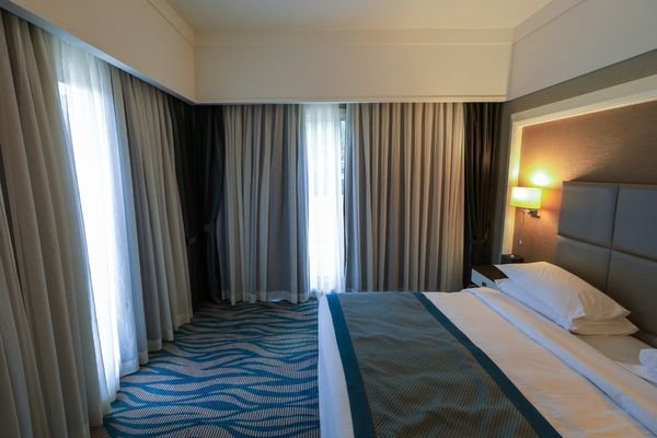 Upholstered headboard with premium fabric finish.